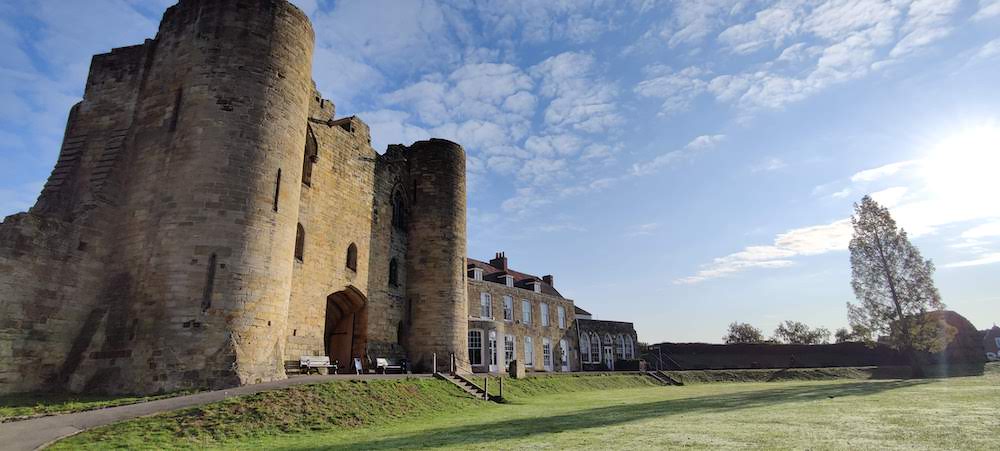 Tonbridge Castle in winter with blue sky backdrop