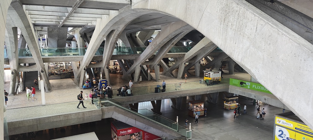 Inside view of Oriente train station below platforms concrete curved pillars