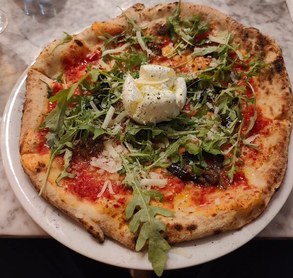 pizza with whole mozzarella ball in middle