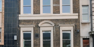 exterior view of Apulia and previous signage Barley Mow Tavern