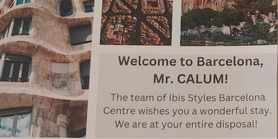 A colourful welcome letter with photos of attractions from the Ibis Styles hotel in Barcelona addressed to Mr Calum