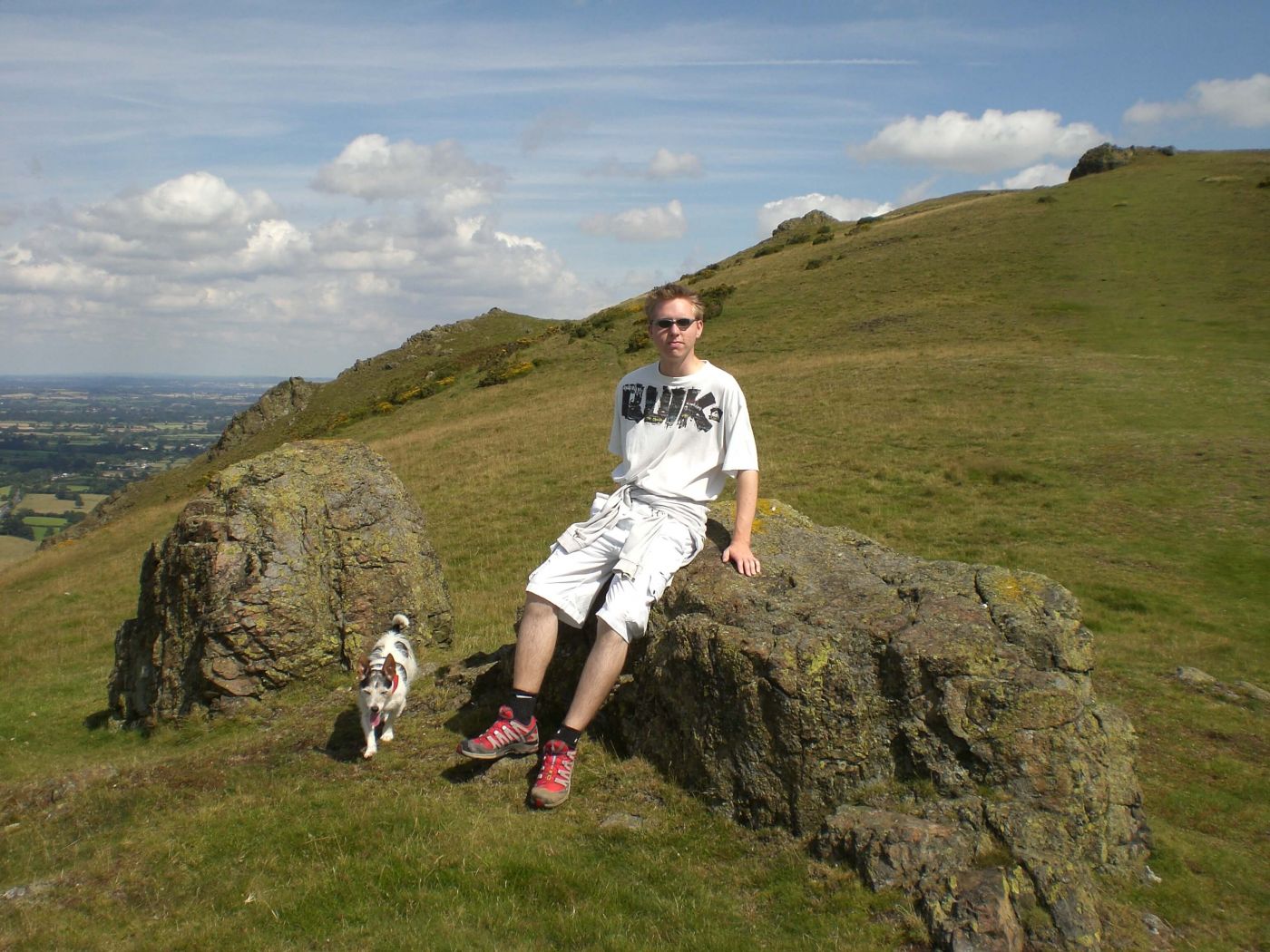 Calum on Caer Caradoc in the Shropshire Hills with his dog Berthe