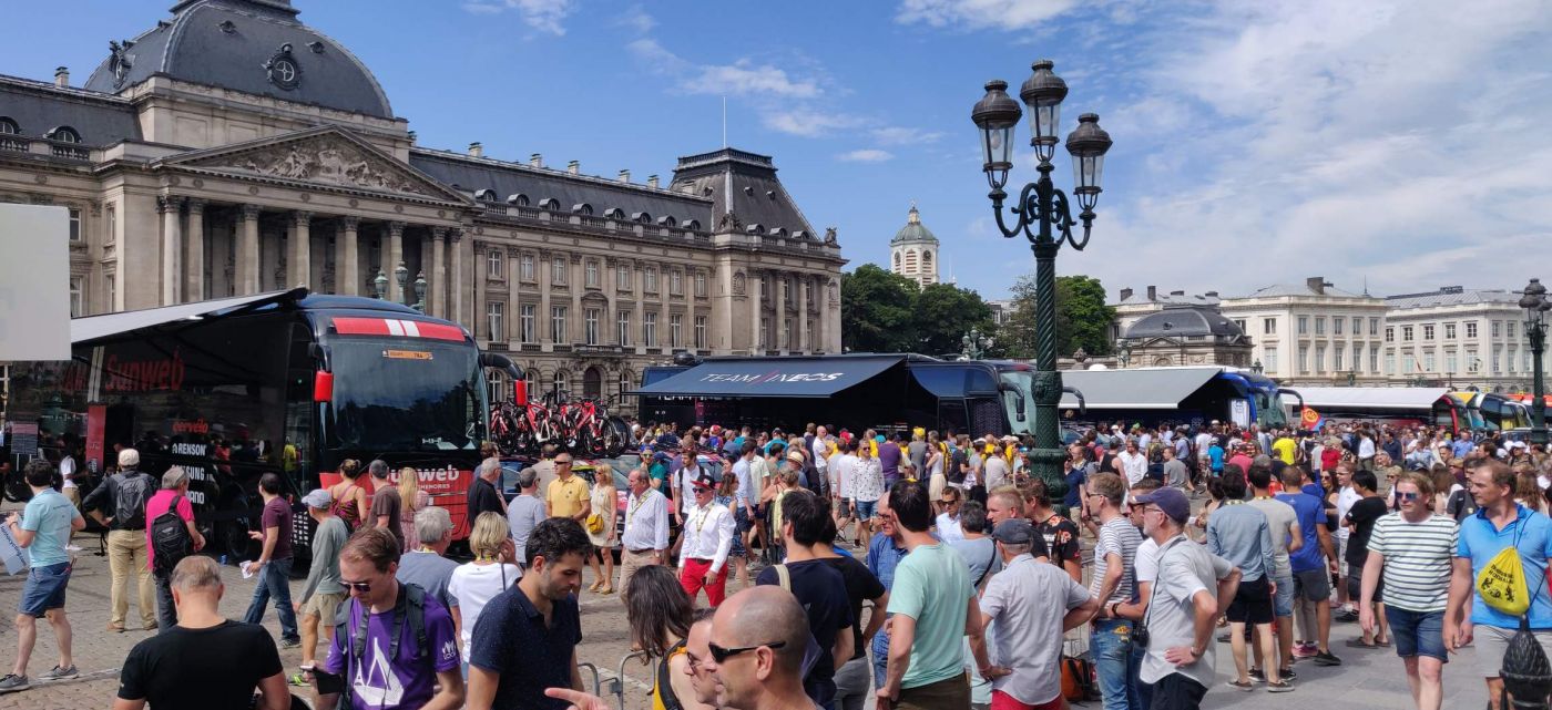 Crowds surrounding Le Tour team coaches outside in Brussels