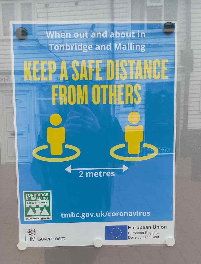 Poster in Tonbridge  warning on 2 metre distancing with EU logo